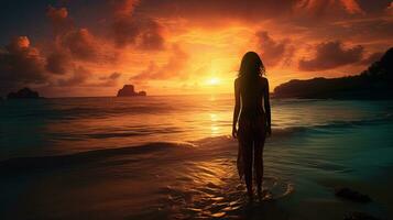 seul femme silhouette à le coucher du soleil plage photo