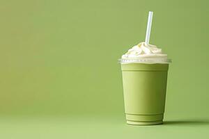 vert thé frappucino avec fouetté crème dans une à emporter tasse isolé sur vert Contexte avec copie espace. ai généré photo