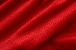 fond de texture de maillot de football de tissu de vêtements de sport rouge photo