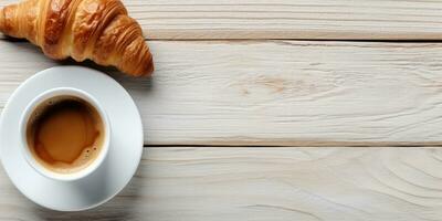 une tasse de café et une croissant sur une blanc en bois table ai généré photo