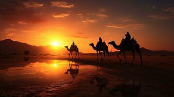 cavaliers sur chameaux pendant le coucher du soleil. silhouette concept photo