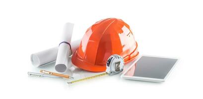 construction outils et équipement. casque ruban mesure avec moderne La technologie tablette photo