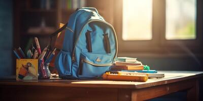 bleu école sac avec accessoire sur vide Contexte. retour à école concept. photo