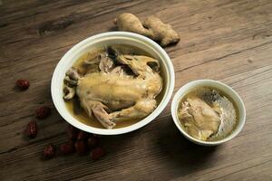 poulet soupe et en bois Contexte. photo