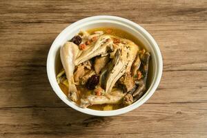 poulet soupe et en bois Contexte. photo