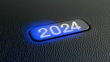 début bouton année 2024 métallique bleu lueur sur noir cuir Contexte photo