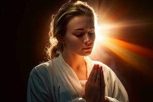une femme dans une peignoir est prier dans de face de le Soleil génératif ai photo