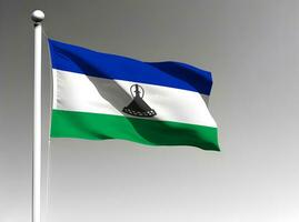 Lesotho nationale drapeau agitant sur gris Contexte photo