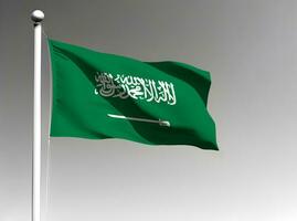 saoudien Saoudite nationale drapeau agitant sur gris Contexte photo