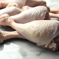 non cuit poulet jambes sur marbre Contexte. ai génératif photo