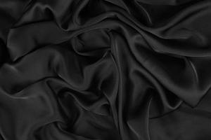 La texture lisse et élégante du tissu de soie ou de satin de luxe peut être utilisée comme arrière-plan de mariage. design de fond luxueux. photo