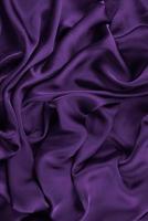tissu de fond. tissu textile foncé avec une texture et un fond de draperie à motifs photo