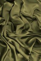 La texture lisse et élégante de la soie ou du satin peut être utilisée comme arrière-plan abstrait. design de fond luxueux