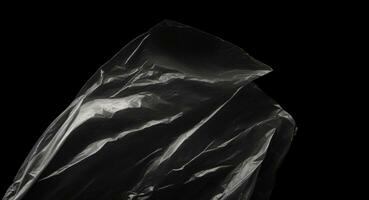 ridé Plastique emballage texture sur une noir Contexte. ai généré photo