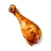 croustillant d'or rôti poulet pilon franchement isolé sur une blanc Contexte photo