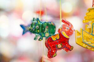 décoré coloré lanternes pendaison sur une supporter dans le des rues dans ho chi minh ville, vietnam pendant milieu l'automne festival. chinois Langue dans Photos signifier argent et bonheur