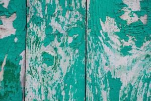 texture de la vieille peinture craquelée sur des planches de bois.