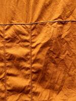 Orange en tissu texture. utile comme Contexte photo