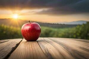 un Pomme est assis sur une en bois table dans de face de une le coucher du soleil. généré par ai photo