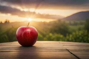 un Pomme est assis sur une en bois table dans de face de une le coucher du soleil. généré par ai photo
