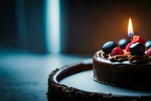une Chocolat gâteau avec baies et une allumé bougie. généré par ai photo