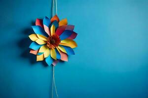 une coloré papier fleur sur une bleu mur. généré par ai photo