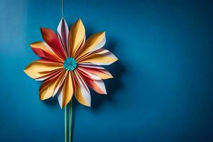 une coloré fleur fabriqué de papier sur une bleu mur. généré par ai photo