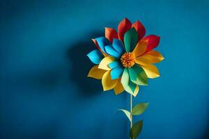 une coloré fleur fabriqué de papier sur une bleu mur. généré par ai photo