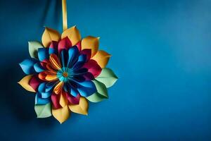 une coloré papier fleur pendaison sur une bleu mur. généré par ai photo