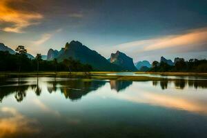 le montagnes sont réfléchi dans le l'eau à le coucher du soleil. généré par ai photo