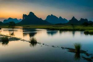 le montagnes sont réfléchi dans le l'eau à le coucher du soleil. généré par ai photo