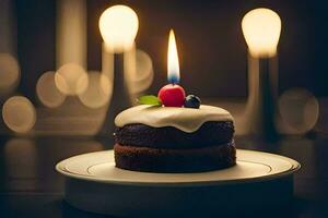 une petit gâteau avec bougies sur une plaque. généré par ai photo