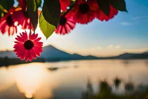 rouge fleurs sont dans de face de une Lac et montagnes. généré par ai photo