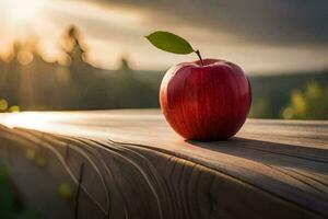 un Pomme est assis sur une en bois table dans de face de une le coucher du soleil. généré par ai photo