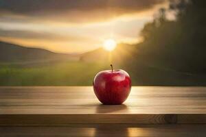 un Pomme est assis sur une table dans de face de une le coucher du soleil. généré par ai photo