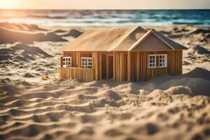 une miniature en bois maison est assis sur le le sable à le plage. généré par ai photo