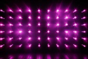 mur orné avec brillant violet LED les lampes, création un incandescent atmosphère ai généré photo