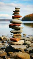 côtier cairn des pierres arrangé dans une bord de mer pyramide, une tranquille et Naturel monument verticale mobile fond d'écran ai généré photo