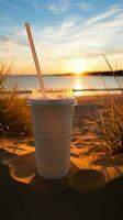 sablonneux caféine Pause blanc tasse avec noir paille sur plage pendant lever du soleil ou le coucher du soleil verticale mobile fond d'écran ai généré photo