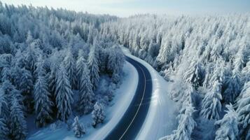 une courbée venteux route dans neige couvert forêt. Haut voir. génératif ai photo