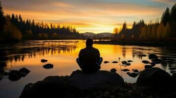 silhouette de la personne méditer par tranquille Lac à coucher de soleil.. génératif ai photo