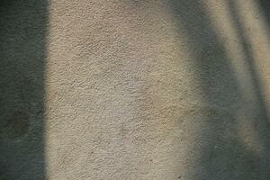 ciment et brique mur texture arrière-plan, Soleil des rayons sur le ciment mur surface, lisse ciment mur toile de fond photo