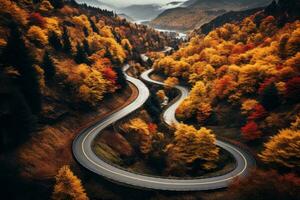 aérien vue de enroulement Montagne route à l'intérieur coloré l'automne forêt. génératif ai photo