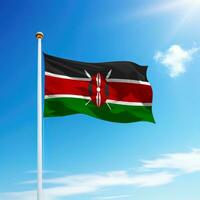 agitant drapeau de Kenya sur mât avec ciel Contexte. photo