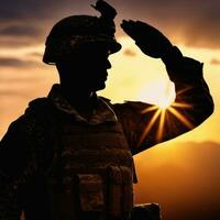 silhouette de une soldat saluer pendant le coucher du soleil ai généré photo
