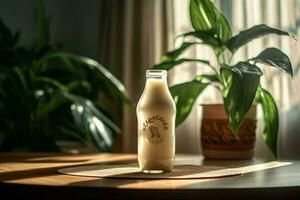 une bouteille de Lait est assis sur une table suivant à une plante photo