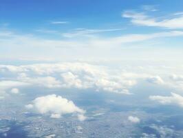 panoramique vue de des champs et des nuages de un avion la fenêtre. le ciel est une brillant bleu avec duveteux blanc des nuages. génératif ai photo