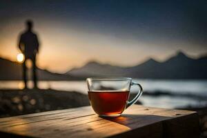 une tasse de thé est assis sur une table dans de face de une homme. généré par ai photo