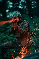 une soldat combats dans une forêt de guerre zone entouré par Feu photo