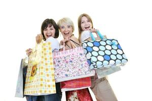 Happy young adult women shopping avec des sacs colorés photo
